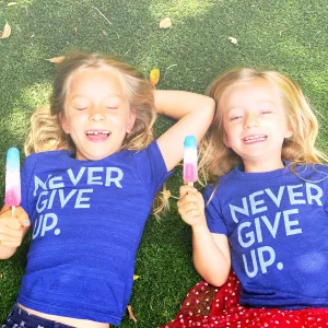 ROYAL BLUE SIGNATURE NEVER GIVE UP. TEE