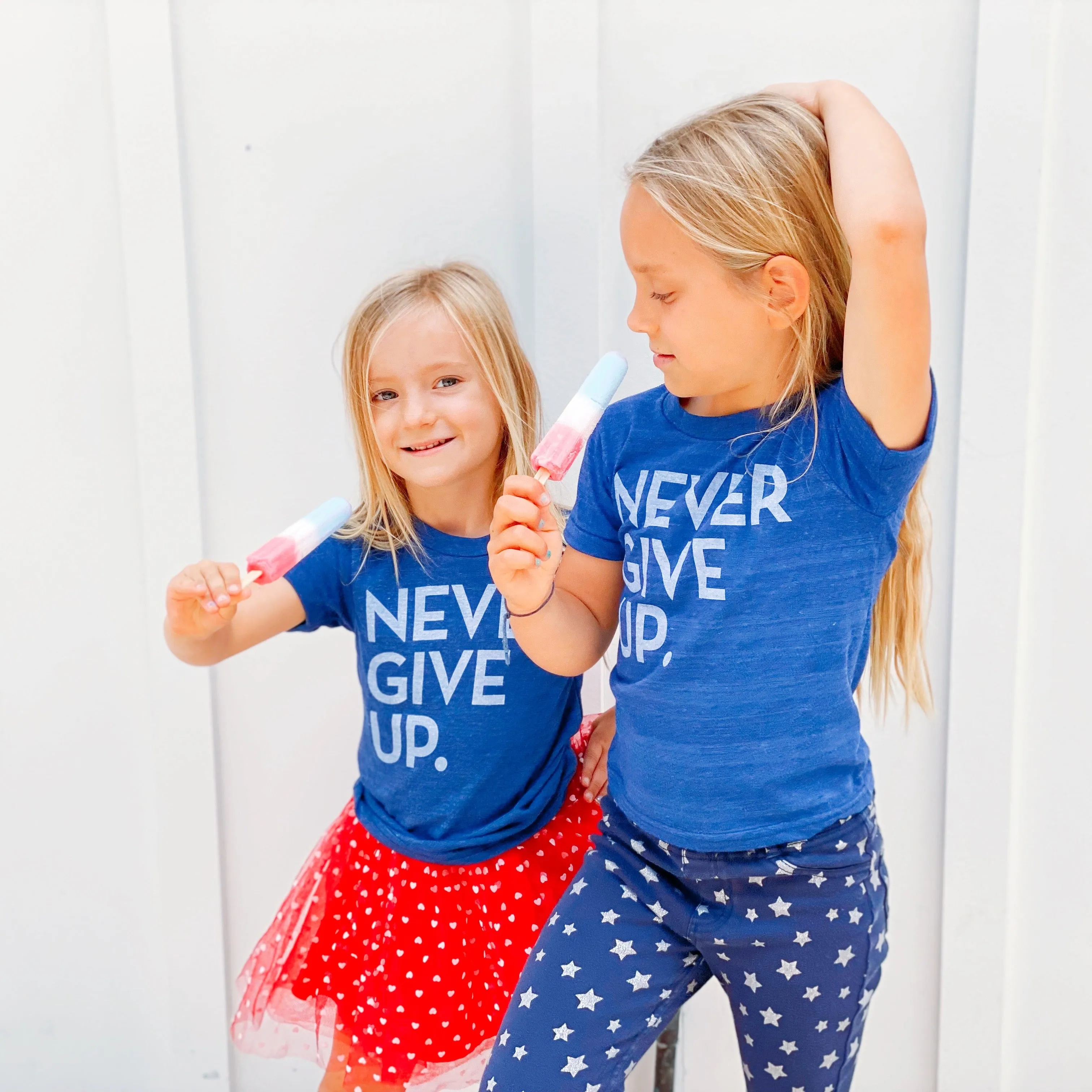 ROYAL BLUE SIGNATURE NEVER GIVE UP. TEE