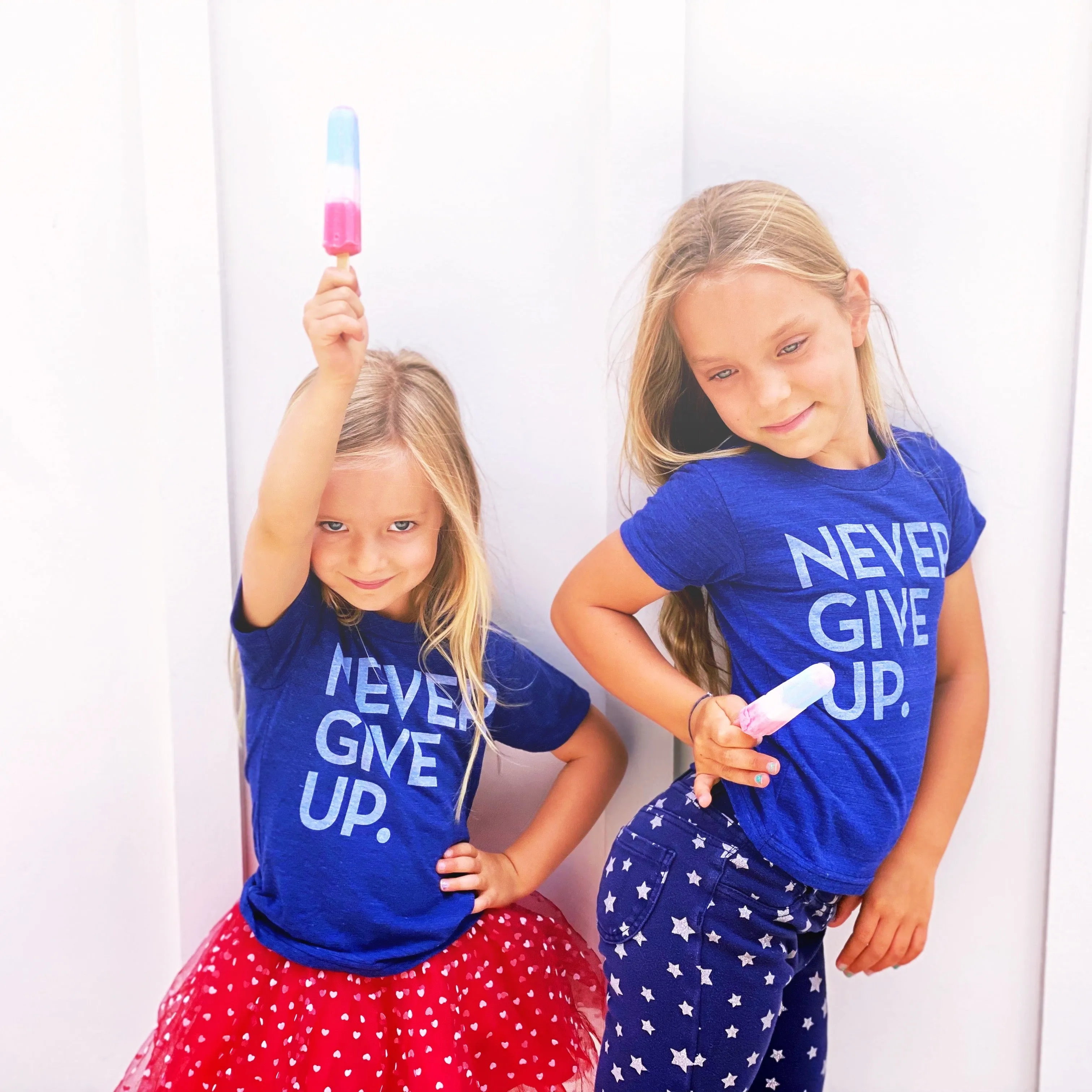 ROYAL BLUE SIGNATURE NEVER GIVE UP. TEE