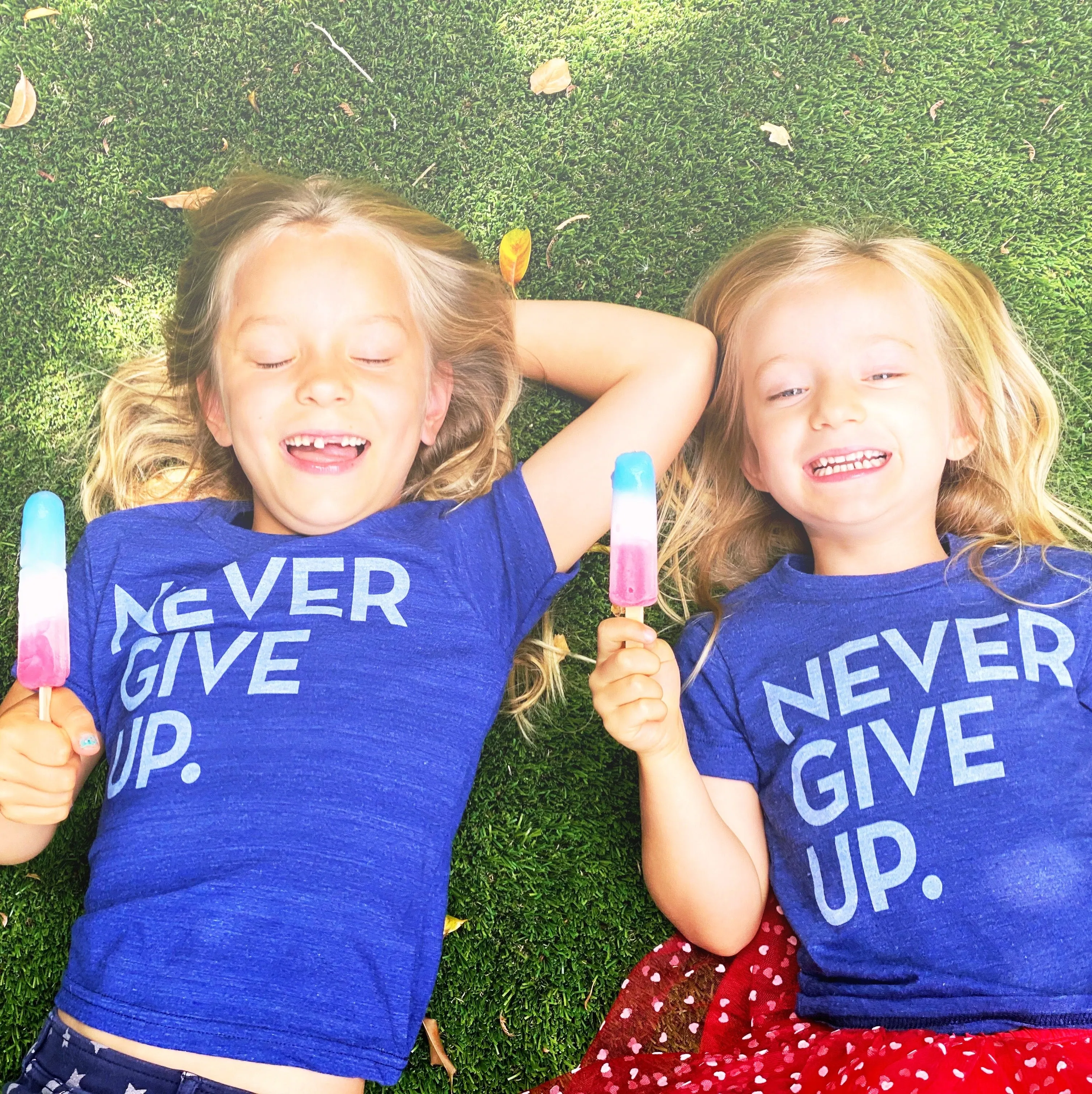 ROYAL BLUE SIGNATURE NEVER GIVE UP. TEE