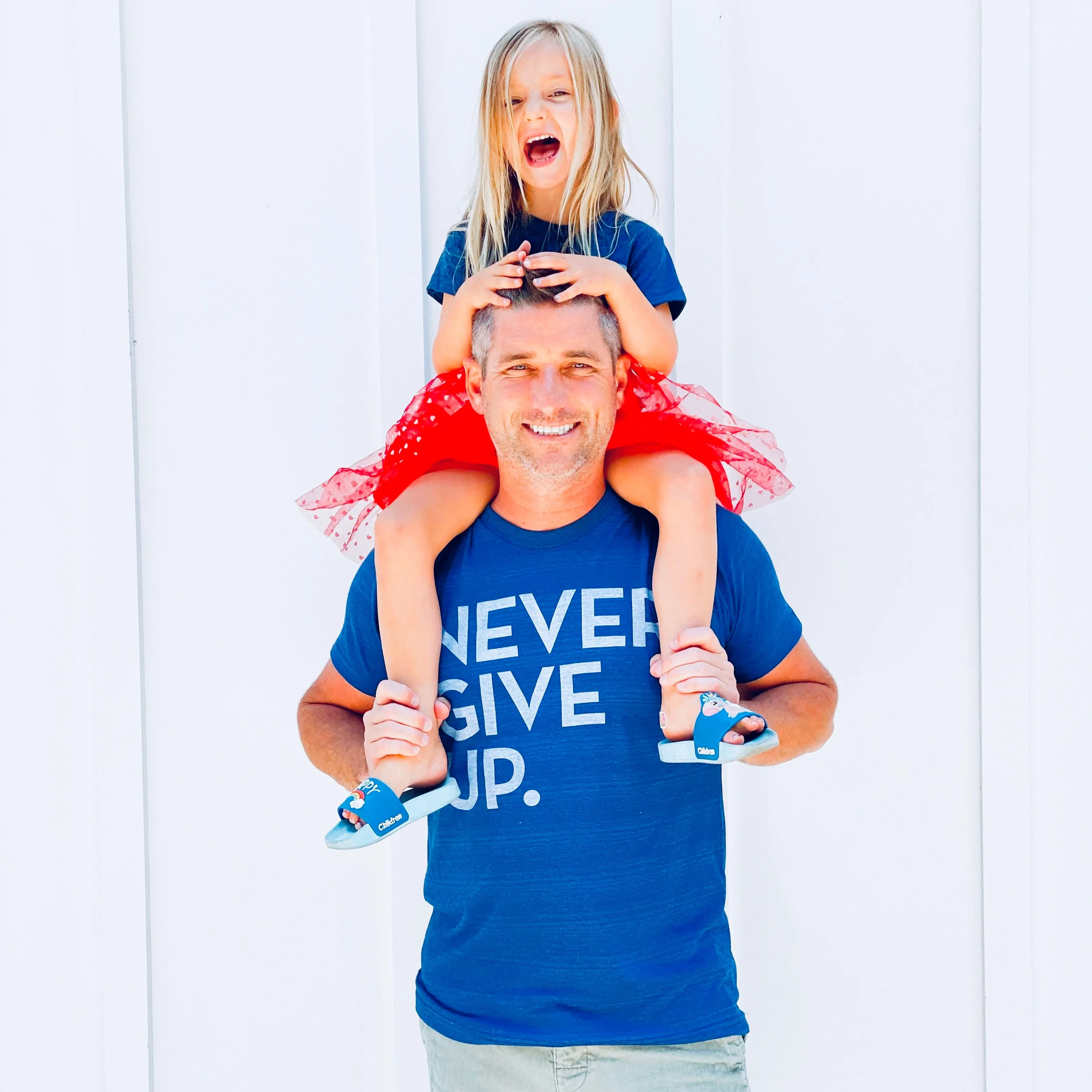 ROYAL BLUE SIGNATURE NEVER GIVE UP. TEE
